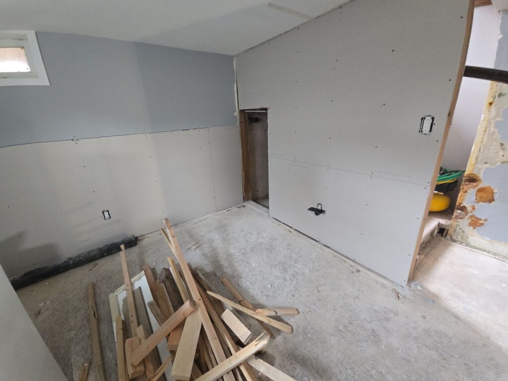 Partially restored room with new drywall