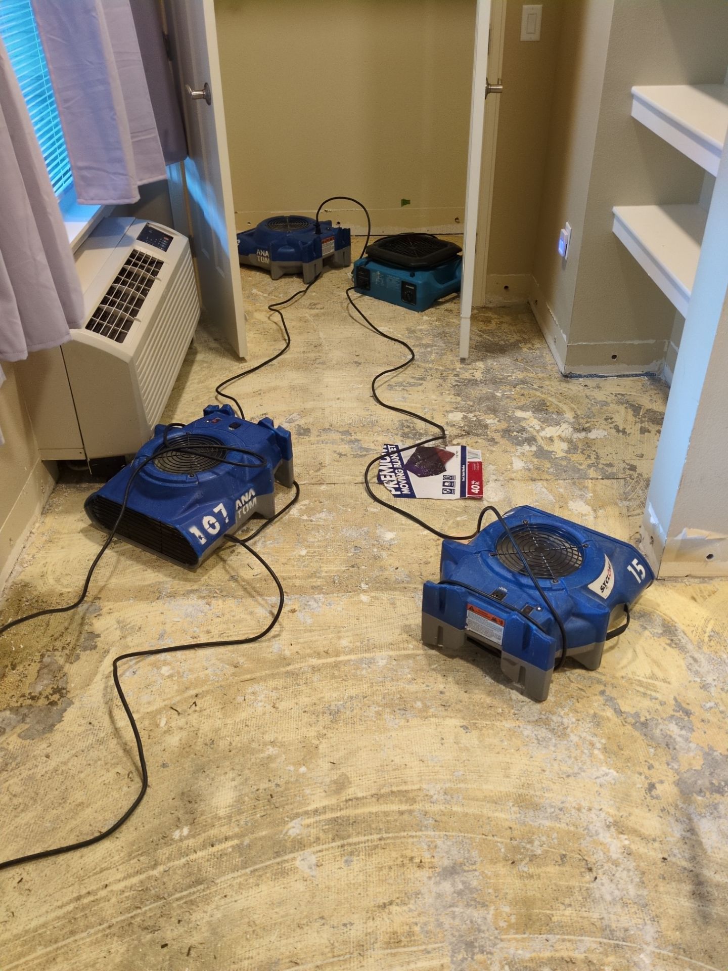 Dehumidifiers and cables on floor