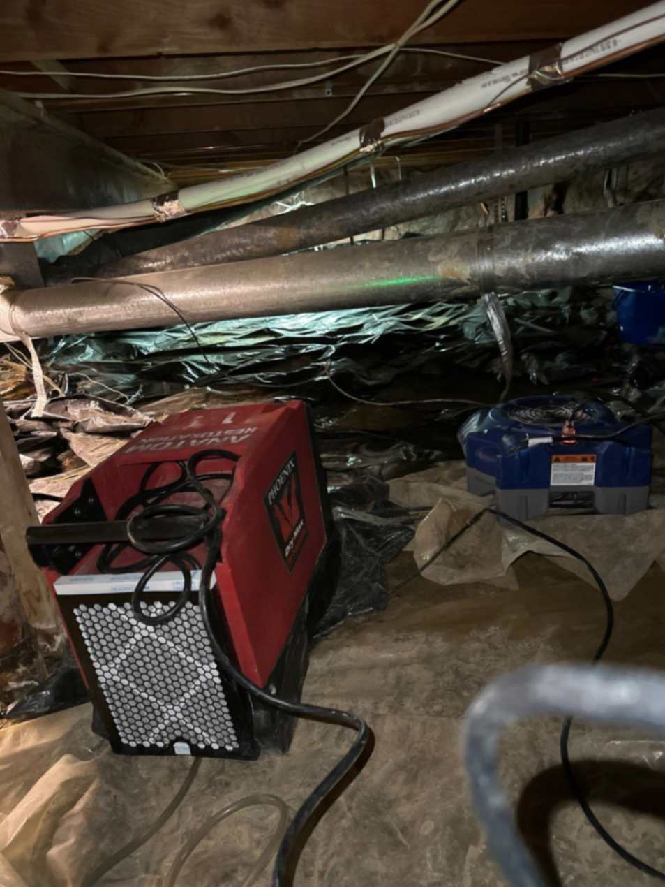 Drying equipment set up in a crawl space
