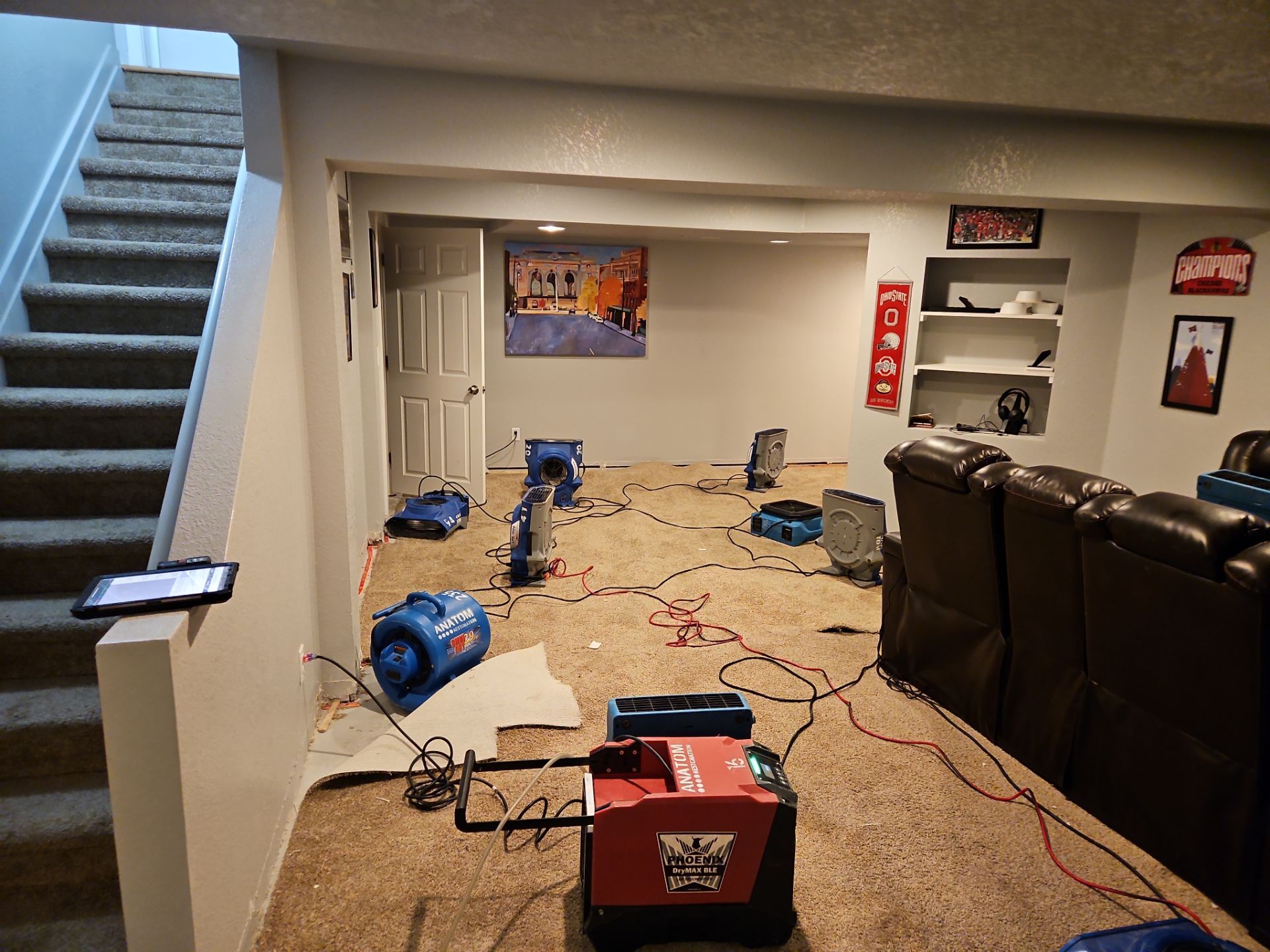 Basement with drying fans and equipment.