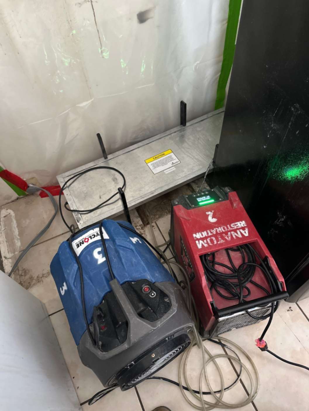 Drying equipment set up in a water-damaged area
