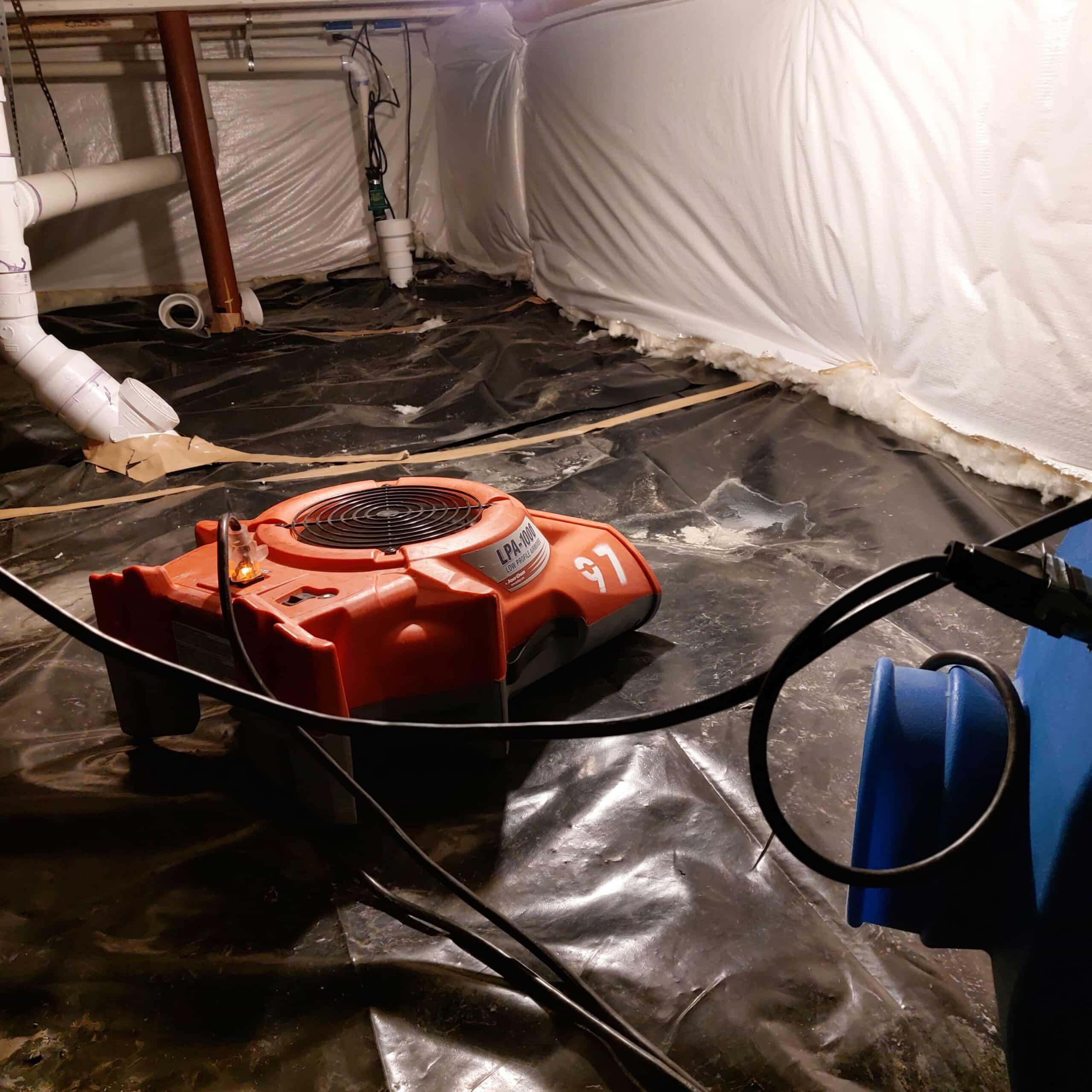 Air mover and drying equipment placed in a sealed crawl space.