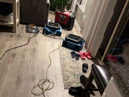 Living Room Water Damage Dry-Out with Air Movers and Dehumidifier in Operation