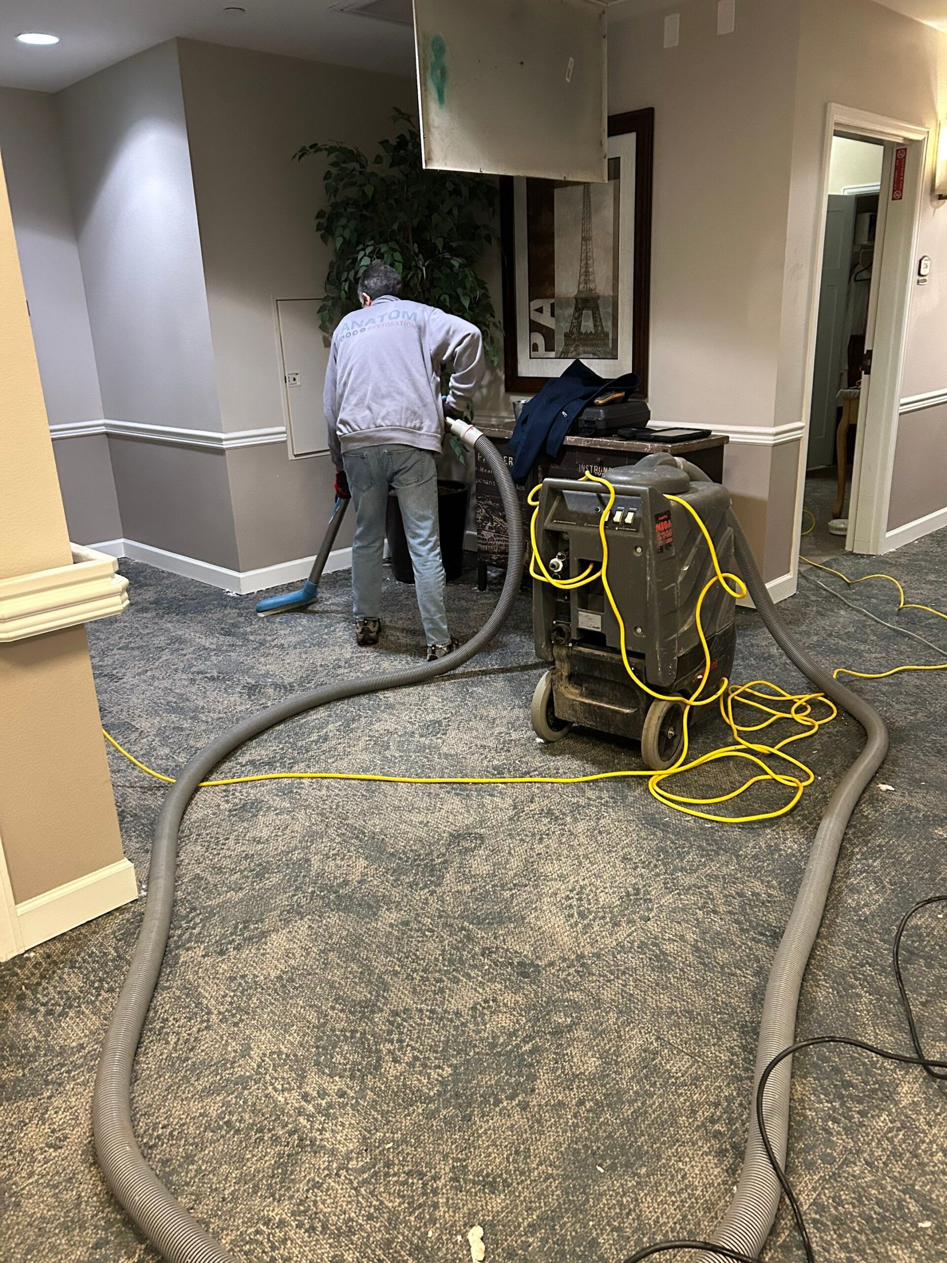 Worker performing water cleanup