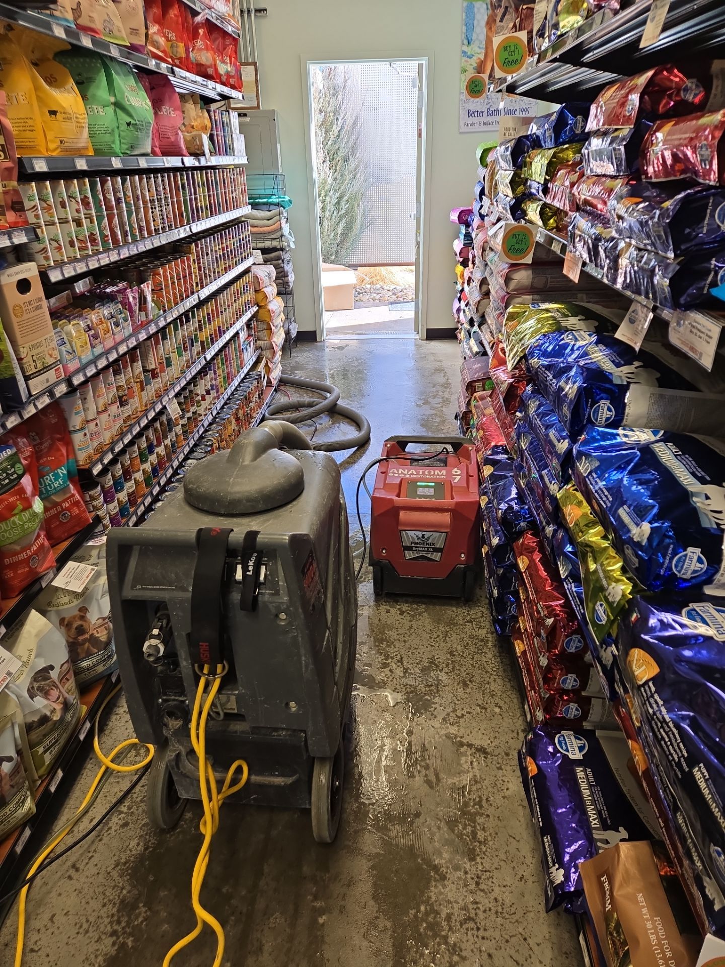 Flood cleanup in a pet store aisle