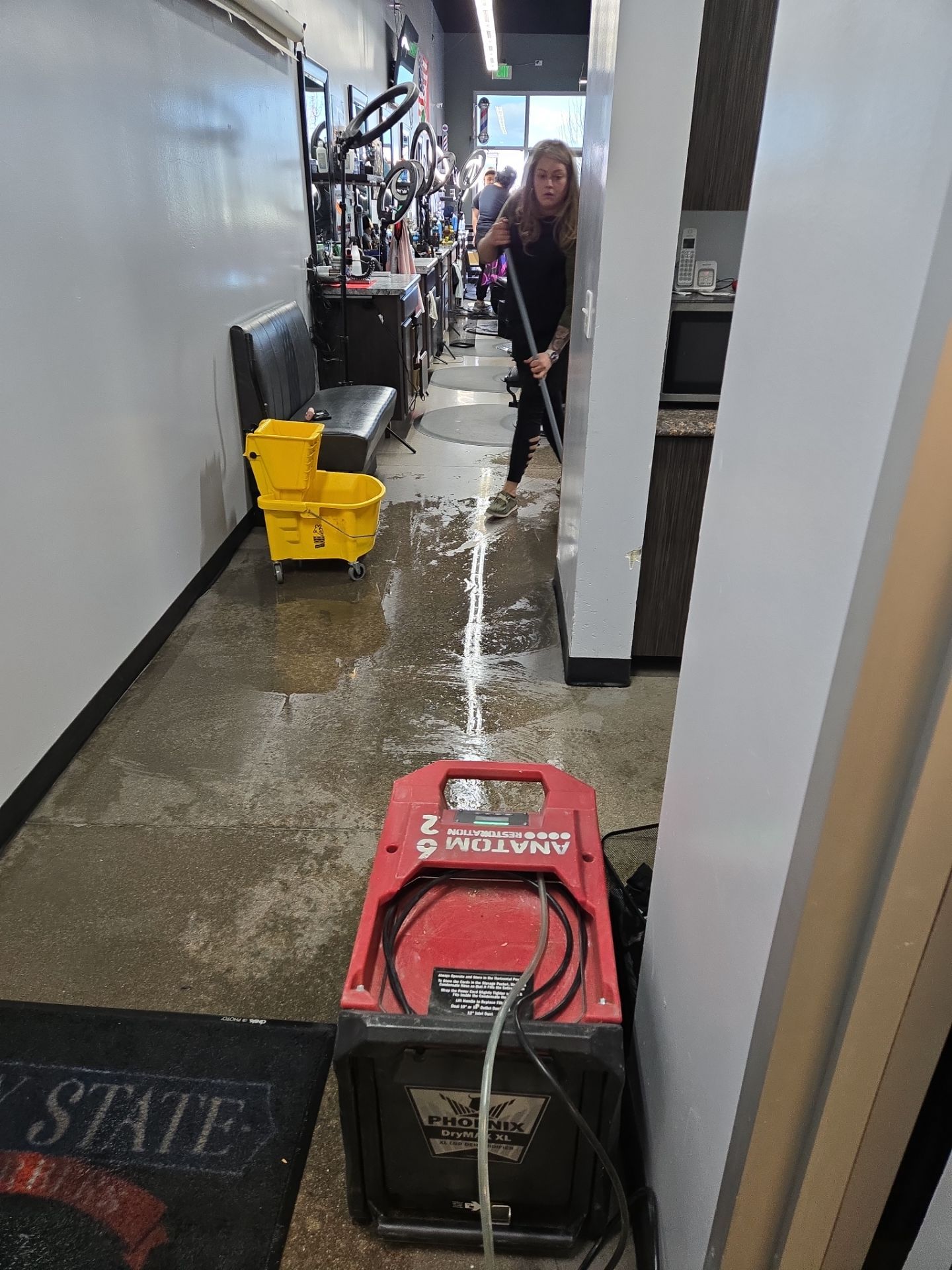 Salon floor flooding cleanup