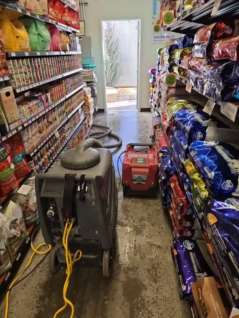 Flood cleanup in a pet store aisle