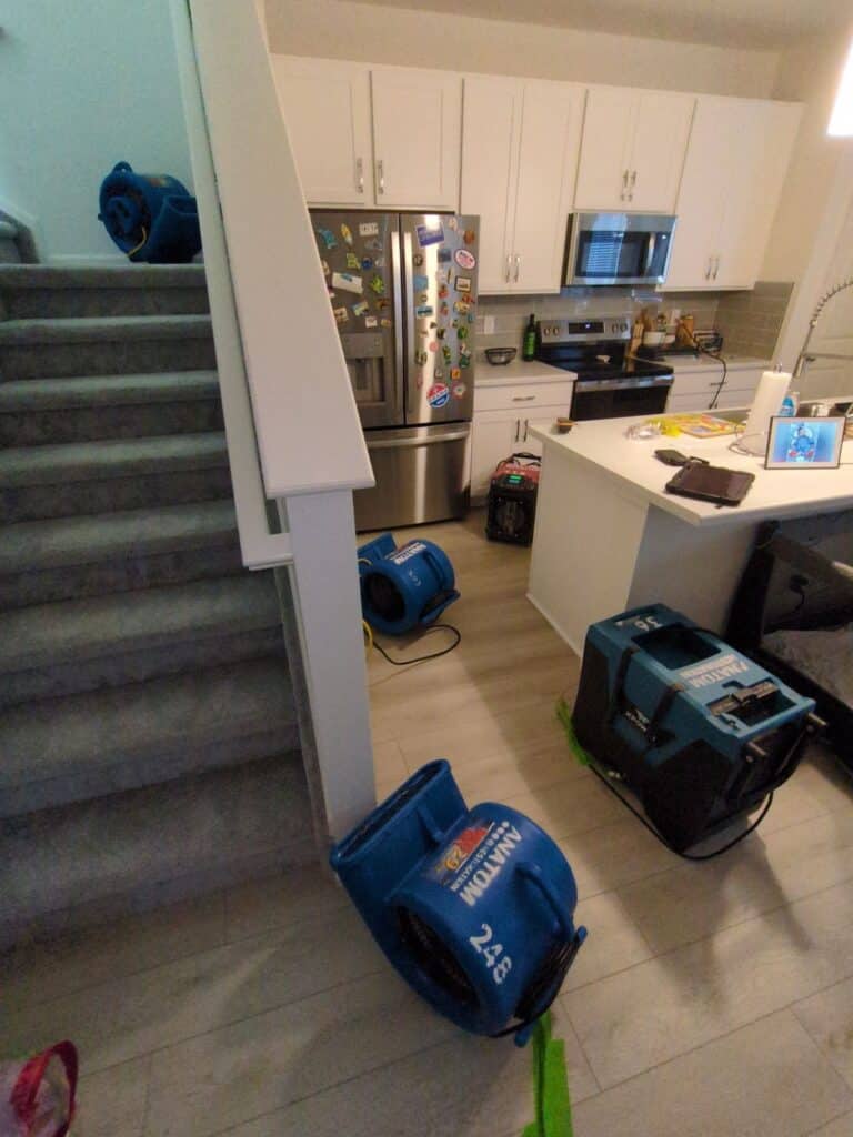 Drying equipment set up during commercial water damage restoration in Denver property