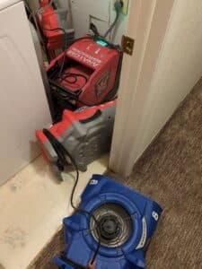 Water damage drying equipment set up inside a Denver home after moisture intrusion