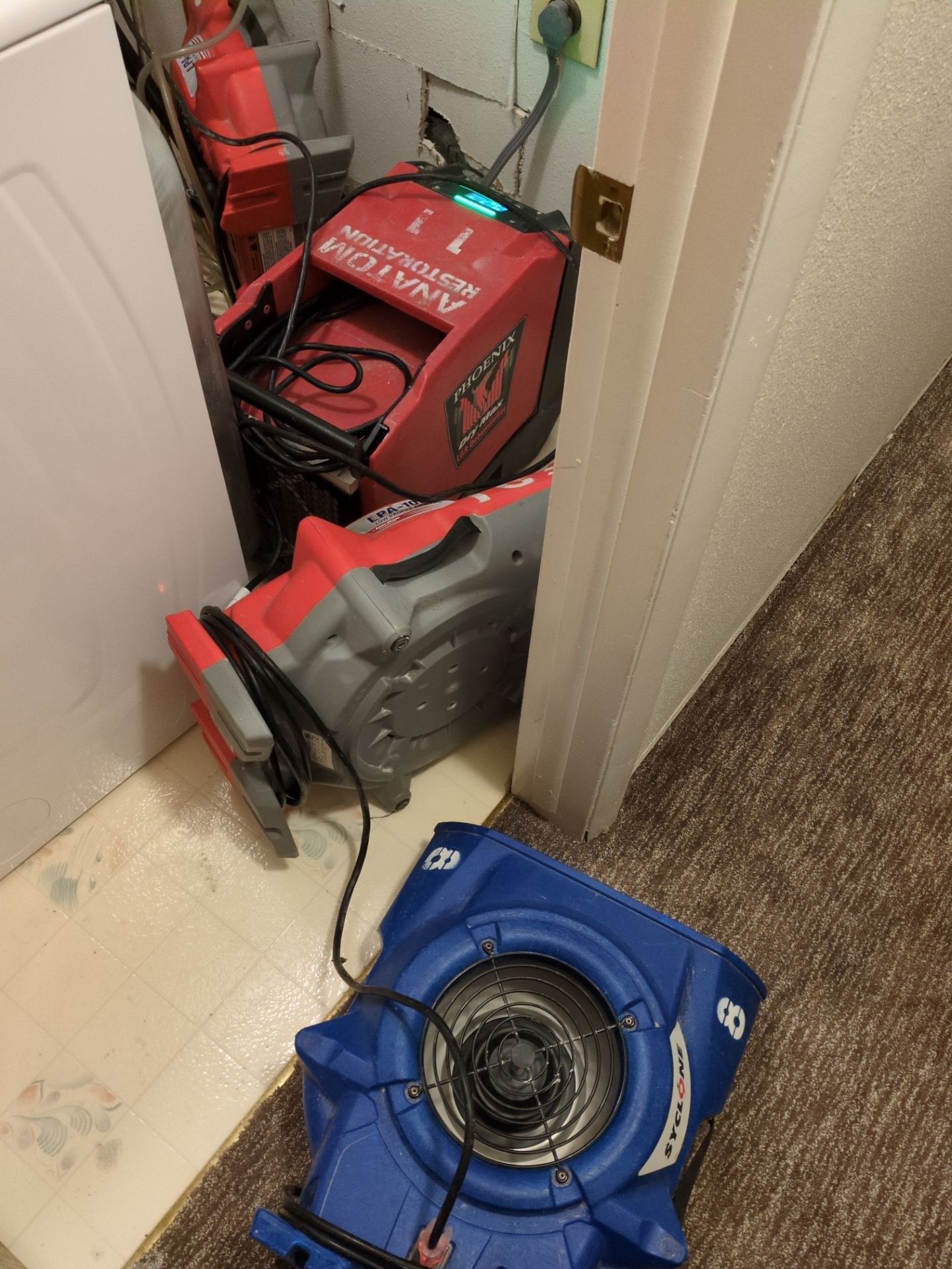 Water damage drying equipment set up inside a Denver home after moisture intrusion