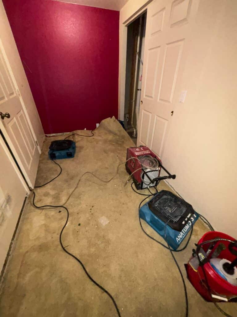 Commercial drying equipment set up in a Denver home after water damage caused by freeze-thaw cycle issues and moisture intrusion.