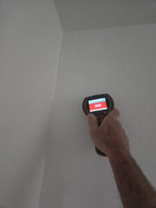 Wall moisture meter inspection checking hidden moisture and mold risk